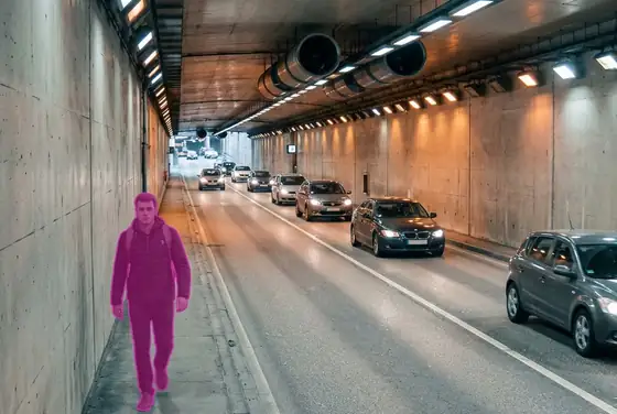 AI segmentation mask flagging a pedestrian walking against the flow on a one-way tunnel