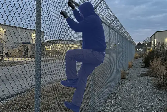 AI segmentation on a person climbing a security fence